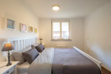 Ferienwohnung Sommerliebe - Freundliches Schlafzimmer