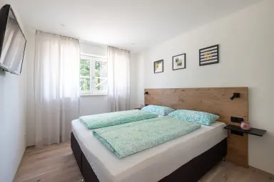 Ferienwohnung Heimathafen - Schlafzimmer mit Boxspringbett