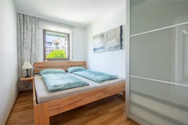 Ferienwohnung Uferresidenz - Schlafzimmer mit Doppelbett