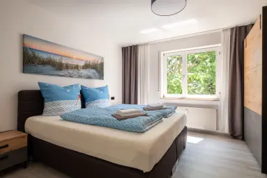 Ferienwohnung Strandgut - Schlafzimmer mit Boxspringbett